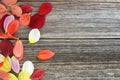 Valentines Day, Mothers Day, Womens Day concept. Top view of dahlia flower petals on wooden background with copy space