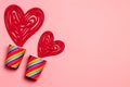 Valentines Day. Paper cups rainbow, hearts on a soft pink background. The concept of gay pride, LGBT community, adoption and human Royalty Free Stock Photo