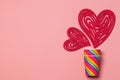 Valentines Day. Paper cups rainbow, hearts on a soft pink background. The concept of gay pride, LGBT community, adoption and human Royalty Free Stock Photo