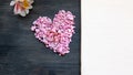 Valentines day paper heart and flowers on brown wooden background Royalty Free Stock Photo