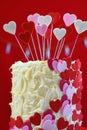 Valentines Day party table with showstopper hearts cake. Royalty Free Stock Photo