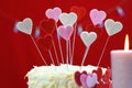 Valentines Day party table with showstopper hearts cake. Royalty Free Stock Photo