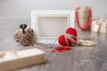 Valentines day photo frame or greeting card and handmade hearts over wooden table. Royalty Free Stock Photo