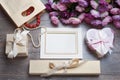 Valentines day photo frame or greeting card and handmade hearts over wooden table. Royalty Free Stock Photo