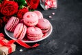 Valentines day pink cake macarons with red roses Royalty Free Stock Photo