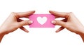 Valentines Day postcard with shape Heart in female Hand on white background. Pink Gift card. Love and Happiness symbol