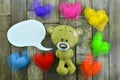 Valentines Day postcard. Teddy Bear and colourful hearts