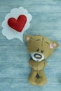 Valentines Day postcard. Teddy Bear and red heart.