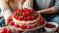 Valentines day Raspberry heart cake or French Fraisier Cake with Diplomat Cream in women hands Royalty Free Stock Photo