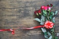 Valentines day red rose flower on wooden background / Red heart with roses and red ribbon Royalty Free Stock Photo