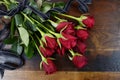 Valentines Day red roses on dark recycled wood