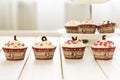 Valentines Day Red Velvet Cupcakes with Sprinkles on Light White Wooden Background, Horizontal View Royalty Free Stock Photo