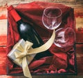 Valentines day. Red wine bottle and glasses in a box Royalty Free Stock Photo