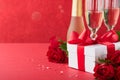 Valentines Day or Romantic dinner concept. Romantic table setting, silverware, wine glasses, gift box, roses and symbol of love re Royalty Free Stock Photo