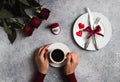 Valentines day romantic dinner table setting woman hand holding cup of coffee