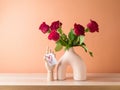 Valentines day romantic still life with red rose bouquet in modern vase on wooden table Royalty Free Stock Photo