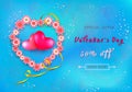 Valentines day sale background in form of heart from paper-cut flowers on blue background.