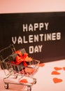 Valentines day sale. Shopping card with gift box