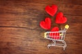 Valentines day shopping and red heart on shopping cart love concept / Shopping holiday for love