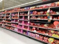 Valentines day specific merchandise and sweets in heart shaped boxes on display in grocery store - California, USA - February,