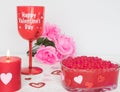 Valentines Day still life with red glass, candle, and pink roses. Romantic Concept on white soft background Royalty Free Stock Photo