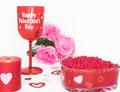 Valentines Day still life with red glass, candle, and pink roses. Romantic Concept on white soft background Royalty Free Stock Photo