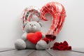 Valentines day surprise with teddybear, balloon and wine glasses Royalty Free Stock Photo