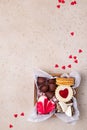 Valentines Day sweets and cookies in wooden box. Chocolate, candy, meringue, marshmallow, linzer cookies, gingerbread. Royalty Free Stock Photo