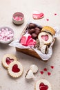 Valentines Day sweets and cookies in wooden box. Chocolate, candy, meringue, marshmallow, linzer cookies, gingerbread. Royalty Free Stock Photo