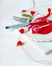 Valentines day table setting with plate, knife, fork, red ribbon Royalty Free Stock Photo