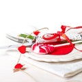 Valentines day table setting with plate, knife, fork, red ribbon Royalty Free Stock Photo