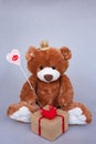 Valentines Day Teddy bear and gift box. Retro romantic style. Unusual creative greeting card