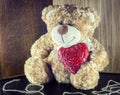 Valentines Day. Teddy Bear Loving cute with red hearts sitting alone. Royalty Free Stock Photo