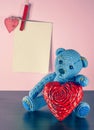 Valentines Day. Teddy Bear Loving cute with red hearts sitting alone. Vintage Royalty Free Stock Photo