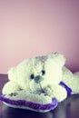 Valentines Day. Teddy Bear Loving cute with red hearts sitting alone. Vintage. Royalty Free Stock Photo