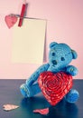 Valentines Day. Teddy Bear Loving cute with red hearts sitting alone. Vintage. Royalty Free Stock Photo