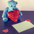 Valentines Day. Teddy Bear Loving cute with red hearts sitting alone. Vintage. Royalty Free Stock Photo