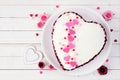 Valentines Day red velvet heart shaped cake over a white wood background Royalty Free Stock Photo