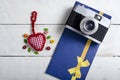 Valentines day toy heart, retro camera and letters.