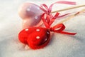 Valentines Day, two red hearts on ice wet snow Royalty Free Stock Photo