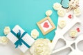 Valentines day, wedding, engagement flat lay, top view. Present gift box, ribbon, hearts, rose flowers, Love, blue paper Royalty Free Stock Photo