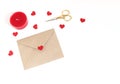 Valentines day or wedding mockup scene with envelope, paper hearts confetti, red candle, golden scissors on white Royalty Free Stock Photo