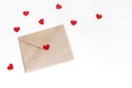 Valentines day or wedding mockup scene with envelope, red paper hearts confetti isolated on white background. Styled Royalty Free Stock Photo