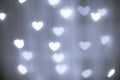 Valentines day white hearts on a gray silver background. Blurring lights bokeh Royalty Free Stock Photo