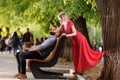 Valentines day. Young loving hipster couple having fun with cones ice cream outdoors at city crowded street. Stylish Royalty Free Stock Photo