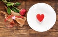 Valentines dinner romantic love food and love cooking concept / Red heart on white plate romantic table setting