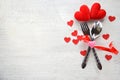 Valentines dinner romantic love concept Romantic table setting decorated with fork spoon and red heart on white wooden Royalty Free Stock Photo