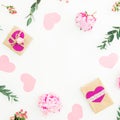 Valentines frame of pink flowers and eucalyptus branches and gifts on white background. Valentines day. Flat lay Royalty Free Stock Photo