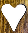 Valentines heart cut out of a wooden plank background texture Royalty Free Stock Photo