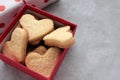 Valentines heart shaped cookies in a kraft gift box on a gray concrete background. Royalty Free Stock Photo